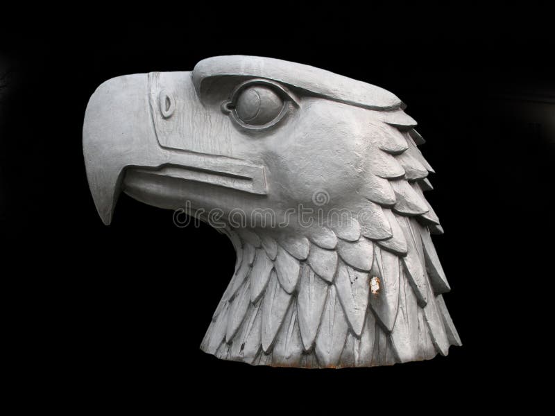 A grey head of an Eagle isolated on black (Statue in Berlin, Germany)