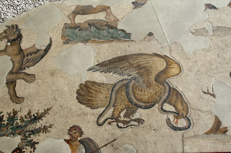 Ancient byzantine mosaics in the great palace of constantinople. the centre piece is the combat of the eagle against the snake symbolising good against evil. Ancient byzantine mosaics in the great palace of constantinople. the centre piece is the combat of the eagle against the snake symbolising good against evil