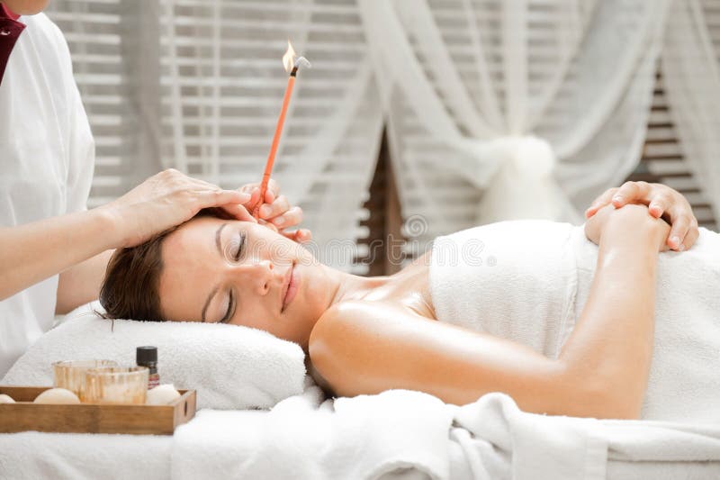 Ear Candling in Spa stock image. Image of looking, peaceful 10869887