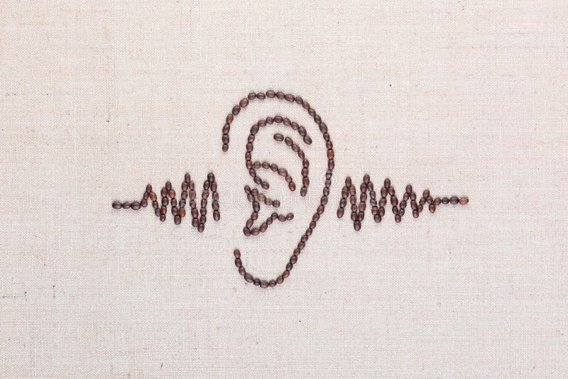 Ear and a sound wave made from coffee beans,aligned in the center