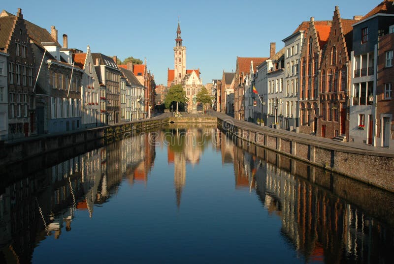 Beautiful houses typical for Bruges reflecting in the Spiegelrei, one of the canals of Bruges. Beautiful houses typical for Bruges reflecting in the Spiegelrei, one of the canals of Bruges.