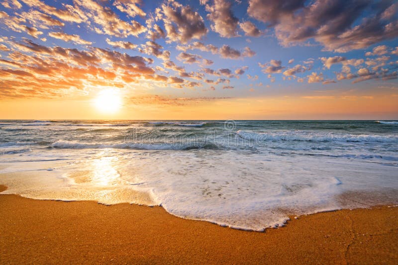 Early morning , sunrise over sea. Golden sands.