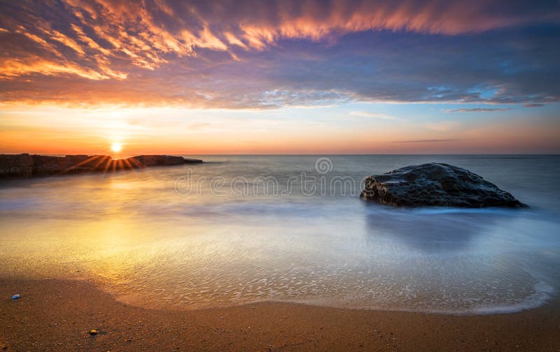 Early morning, sunrise over sea.