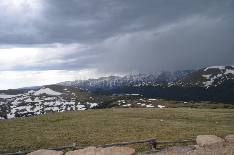 Summer in Rocky Mountain National Park: Mt Stratus, Mt Nimbus, Mt Cumulus, Howard Mtn, Mt Cirrus & Lead Mtn of Never Summer Mtns. Early Summer in Colorado: Dark royalty free stock images Summer in Rocky Mountain National Park: Mt Stratus, Mt Nimbus, Mt Cumulus, Howard Mtn, Mt Cirrus & Lead Mtn of Never Summer Mtns. Early Summer in Colorado: Dark royalty free stock images