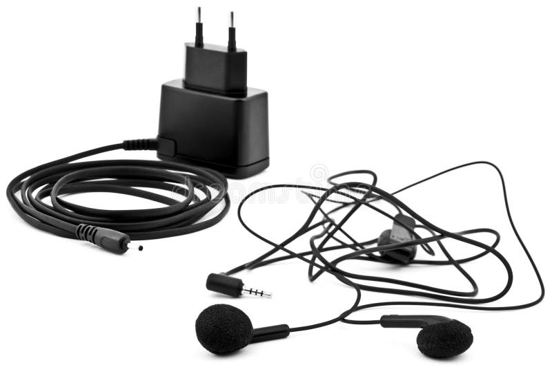 Earphones and charger stock images