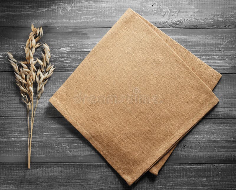 Ears of oat on wood