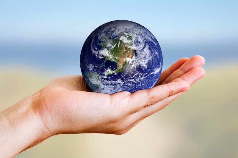 A child's hand holding the earth with care. (Image of earth used with permission from the NASA website.). A child's hand holding the earth with care. (Image of earth used with permission from the NASA website.)