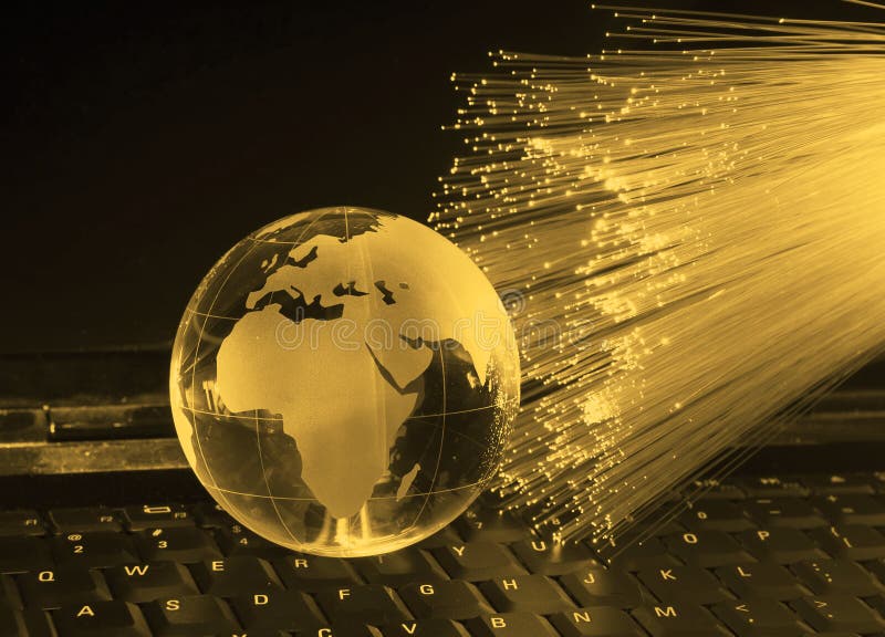 Earth globe against fiber optic stock photo