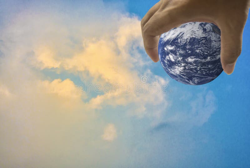 Earth, in a handful, With bright sky as the background stock photo Earth, in a handful, With bright sky as the background stock photo