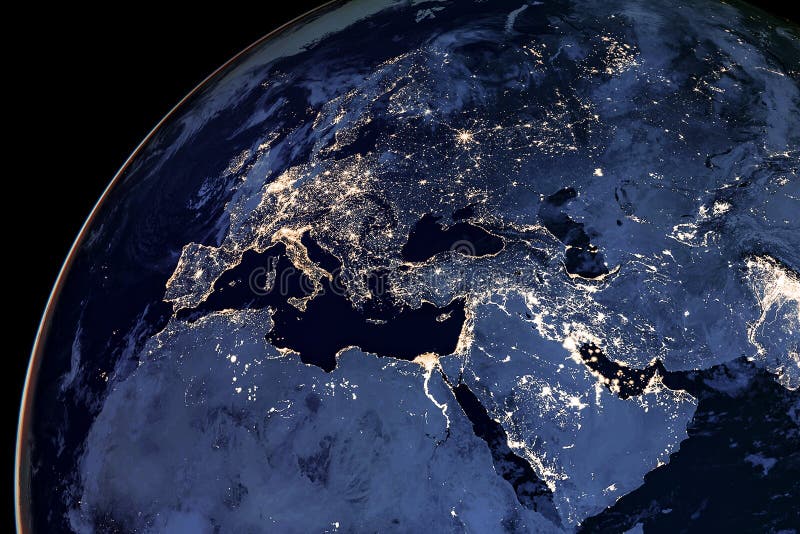 Earth from space at night. View from satellite orbit to the lights of cities in Europe, the Middle East and North Africa on the royalty free stock images