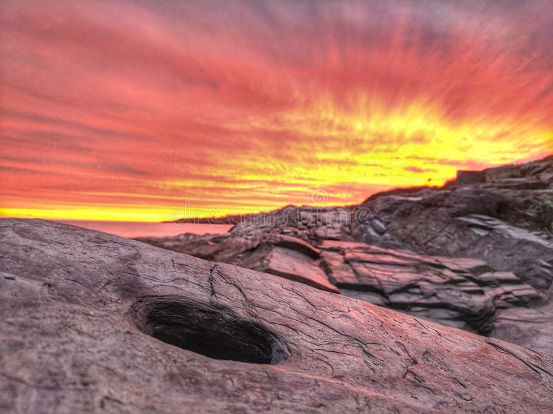 East coast sunset stock image. Image of boulder, sunset 104885791