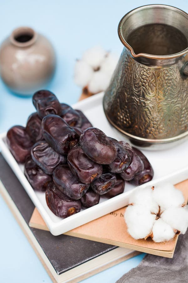 East Dessert. Dates on a Blue Background with a Turk. Healthy Snack. Stock Photo Image of