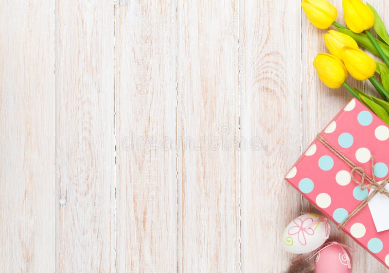 Download Easter Background With Colorful Eggs And Yellow Tulips Stock Photo - Image of gift, beautiful: 65310834