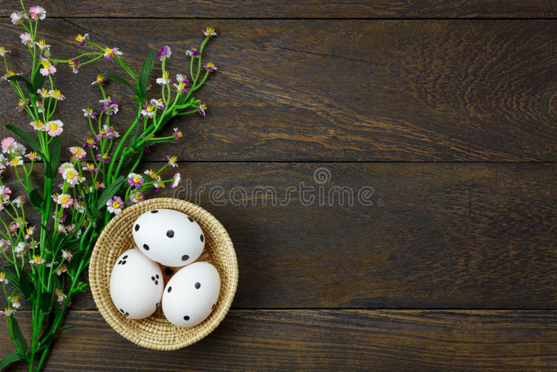 Easter background.Happy easter eggs pained on wood bask