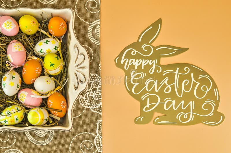 Easter Background with Painted Easter Eggs and Rabbit Wishing Happy