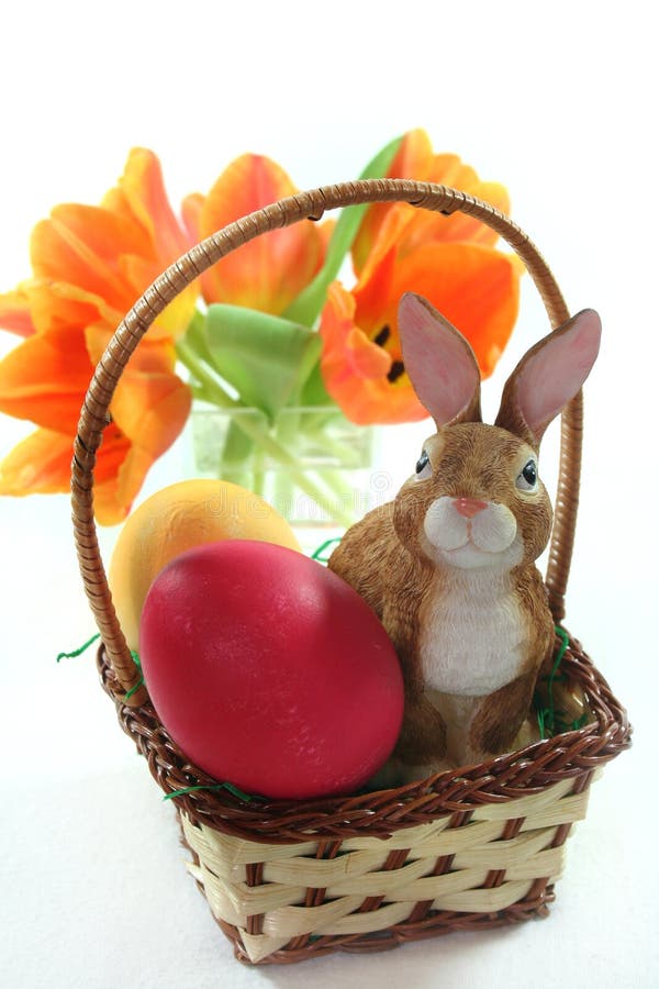 Easter basket with eggs and bunny and tulips