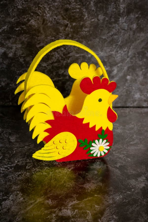 Easter Basket Filled with Hand Painted Pastel Easter Eggs Over a White Background Stock Photo