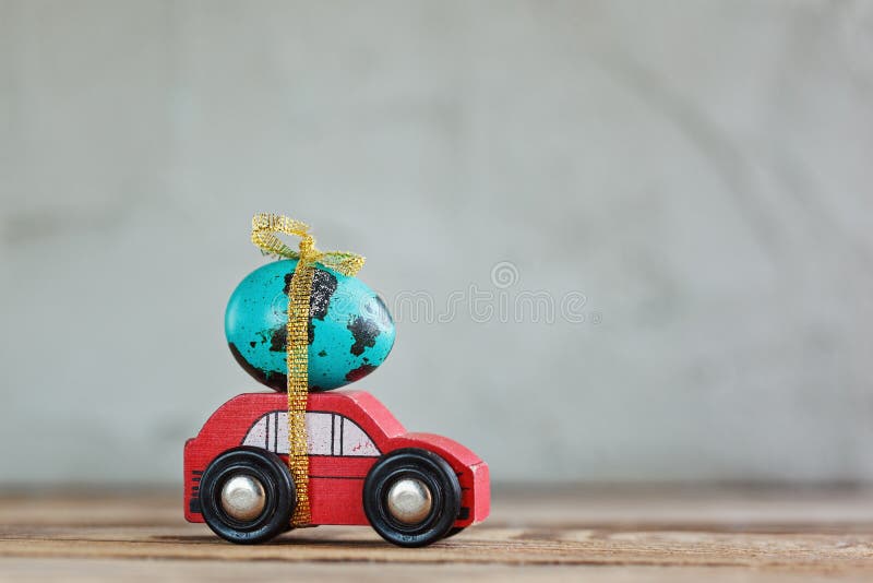 Easter blue egg on red car. Holiday easter concept. Easter blue egg on red car. Holiday easter concept royalty free stock image Easter blue egg on red car. Holiday easter concept. Easter blue egg on red car. Holiday easter concept royalty free stock image