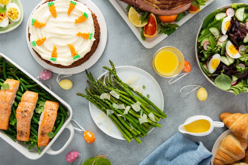 Easter brunch with spiral cut ham and roasted salmon stock images