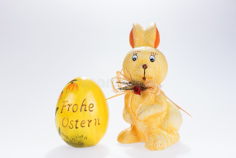 Easter Bunny and Big Easter Egg with the Inscription Happy Easter in