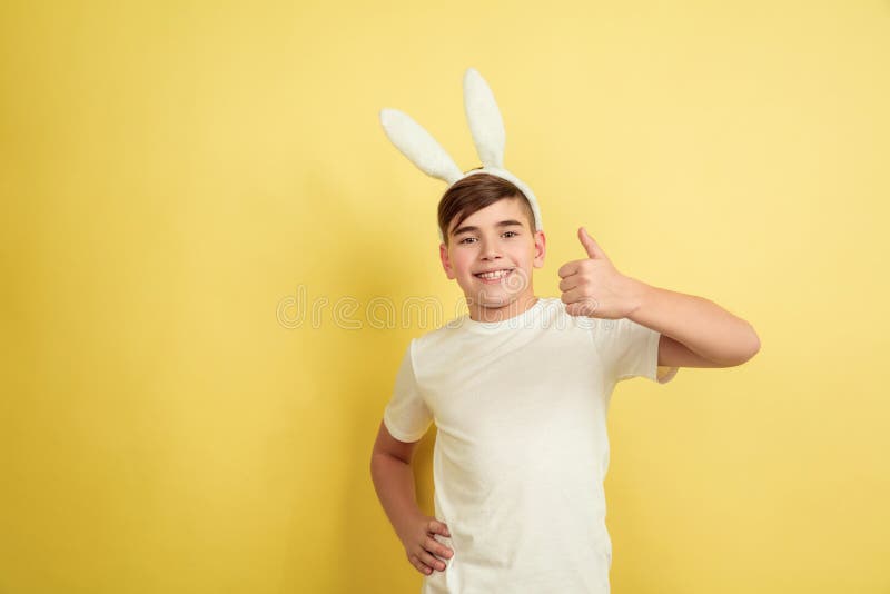 Easter Bunny Boy with Bright Emotions on Yellow Studio Background Stock ...