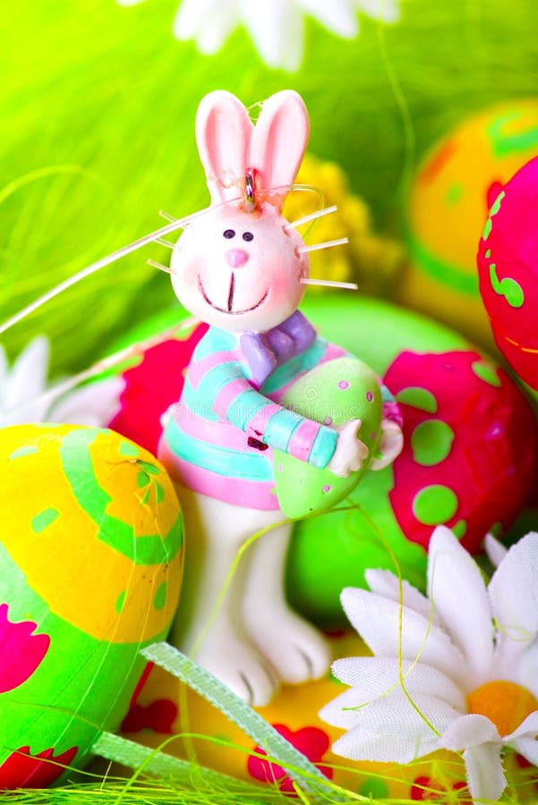 Easter bunny and painted eggs royalty free stock photography