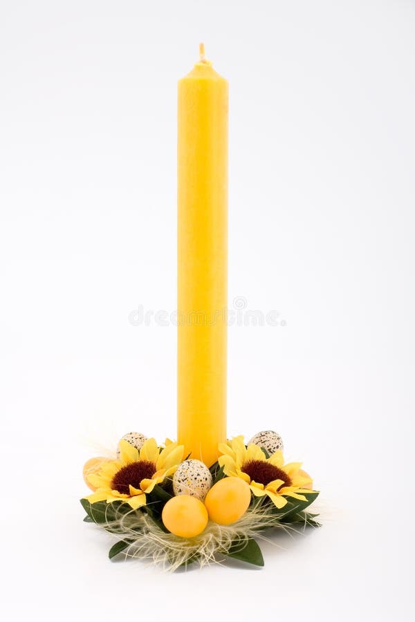 Easter candle with eggs and flowers