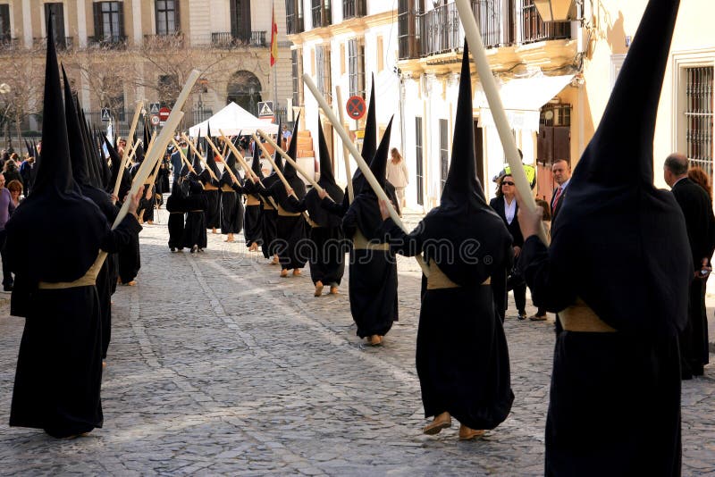 Jerez de la Frontera easter celebration, Spain Europe. During this celebration, the Easter brotherhoods process through the old town of Jerez de la Frontera in a stunning display of art and feeling. A total of 31 brotherhoods take part in the Easter processions in Jerez. The oldest brotherhoods date back to the 15th century, while the youngest had its first procession in 1973. They all make a stop at the Cathedral on their way - known as the station of penitence. Some of the most traditional brotherhoods are those of La Borriquita, El Transporte, La Coronación and Las Angustias. Of all the processions, the ones on Good Friday stand out especially, such as the Most Sacred Christ of the Exaltation, The Virgin of Solitude and the Holy Burial. Easter week is one of the most heartfelt and deep-rooted fiestas celebrated in Spain. This commemoration has centuries of history and tradition, remembering the passion and death of Jesus Christ. The streets of the majority of Spain's cities, towns and villages become the stage for religious fervour and devotion, combining grief and meditation in memory of Christ's death. Music, art and colour come together in magical processions - solemn parades in which crowds of people accompany religious images on their route through the streets. Week processions stock images, royalty-free photos and pictures