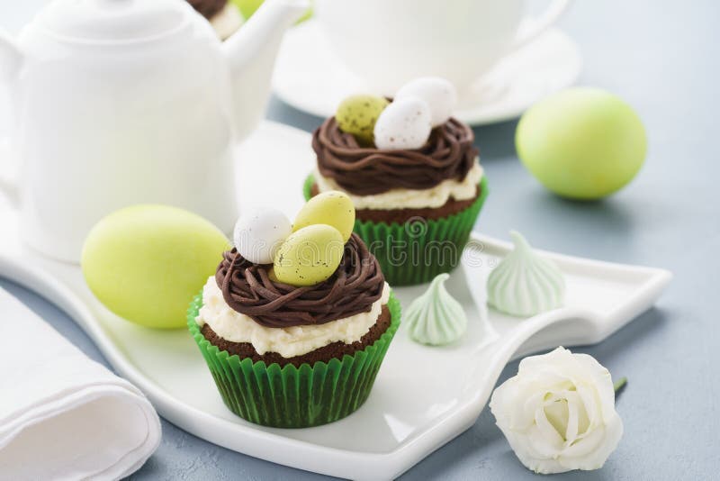 Easter Chocolate Cupcakes with Nest and Eggs for Dessert Stock Image
