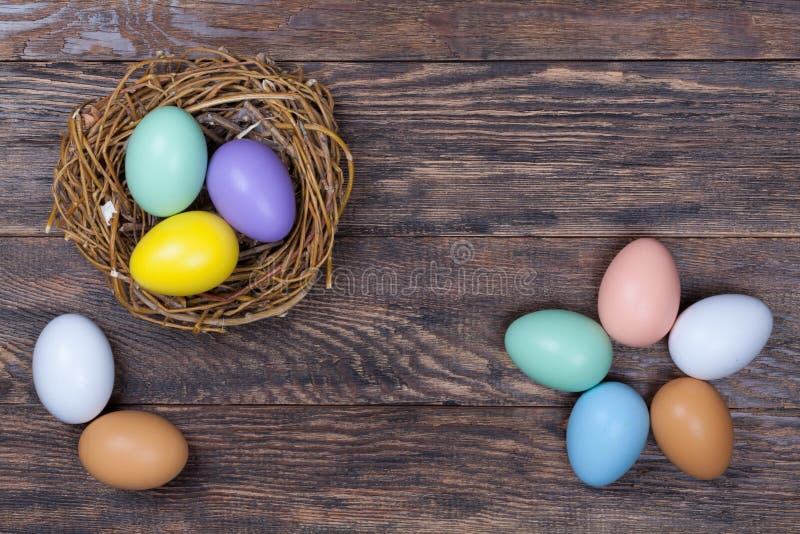Easter Colorful Eggs In Bird Nest On Wooden Background Stock Photo