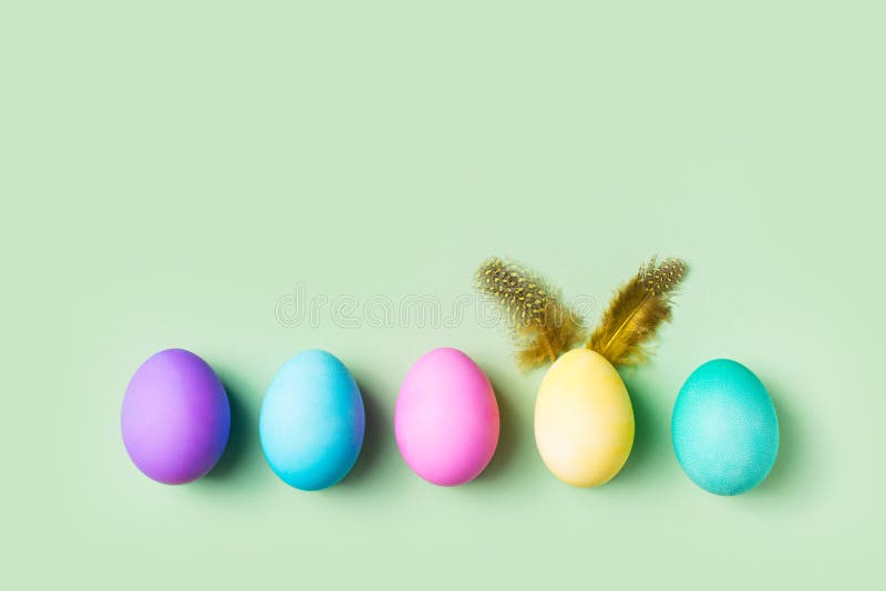 Easter Colorful Flat Lay with Eggs Row and Bunny Egg Stock Image