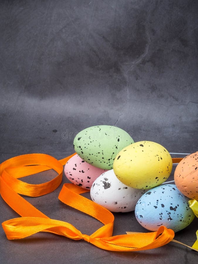 Easter composition with colorful eggs on grey background, space for text stock images Easter composition with colorful eggs on grey background, space for text stock images