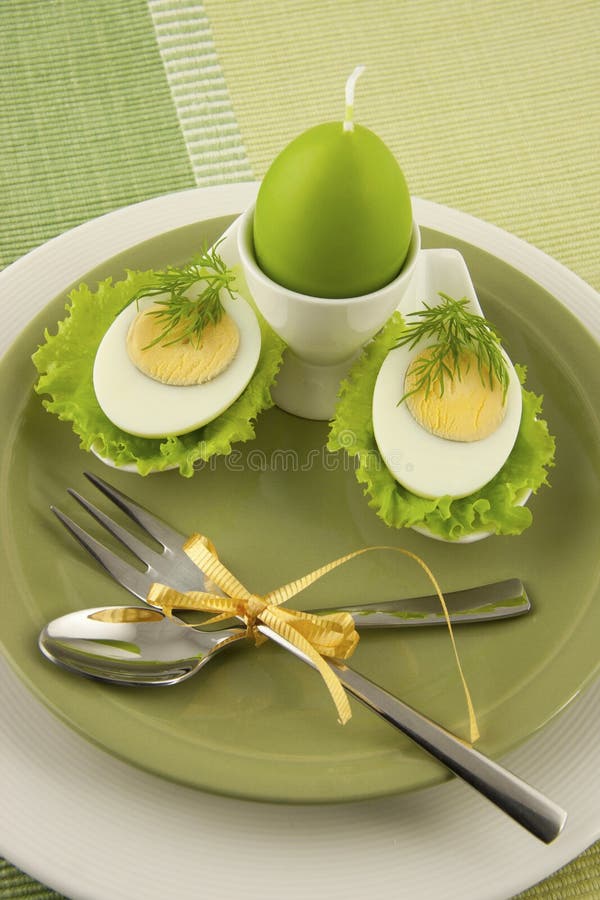 Easter composition with eggs and candle