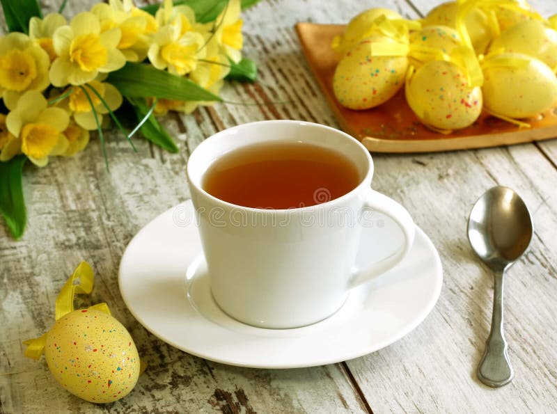 Easter Composition of Tea Cup, Eggs and Flowers on Stock Photo Image