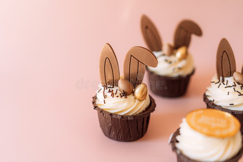 Easter Cupcakes with Bunny Ears on a Pink Background Stock Image