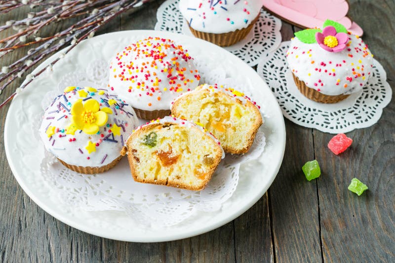 Easter Cupcakes with Candied Fruit and Icing on a Ceramic Plate on a