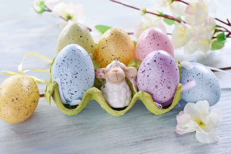 Easter decoration with colorful eggs in carton box
