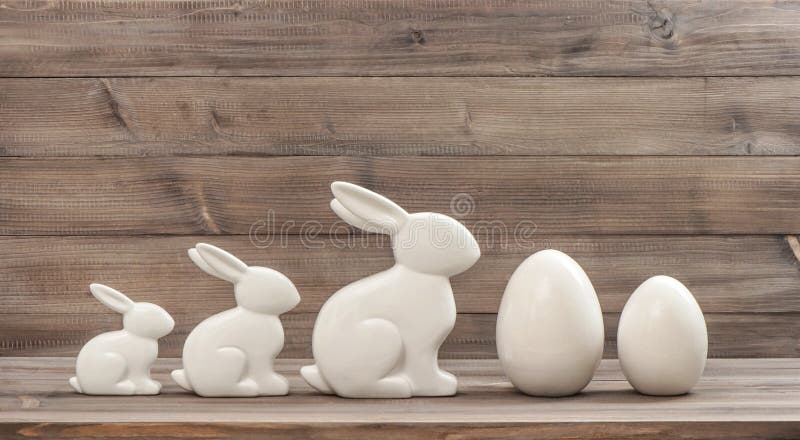 Easter decoration eggs bunnies rustic wooden background