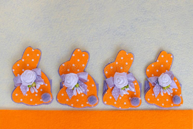 Easter Decoration Easter Orange Bunnies with Ribbons on a Light Background. Easter Pattern