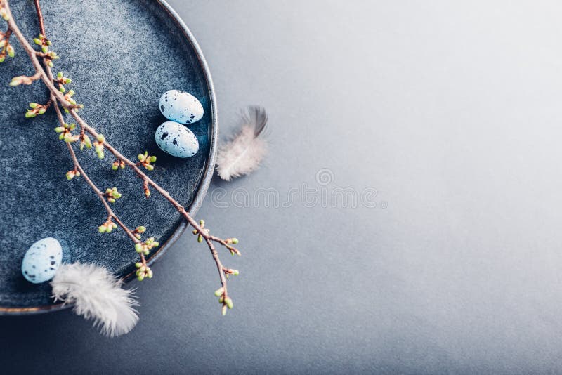 Easter Dish Decorated with Blue Eggs, Feathers and Spring Branches ...