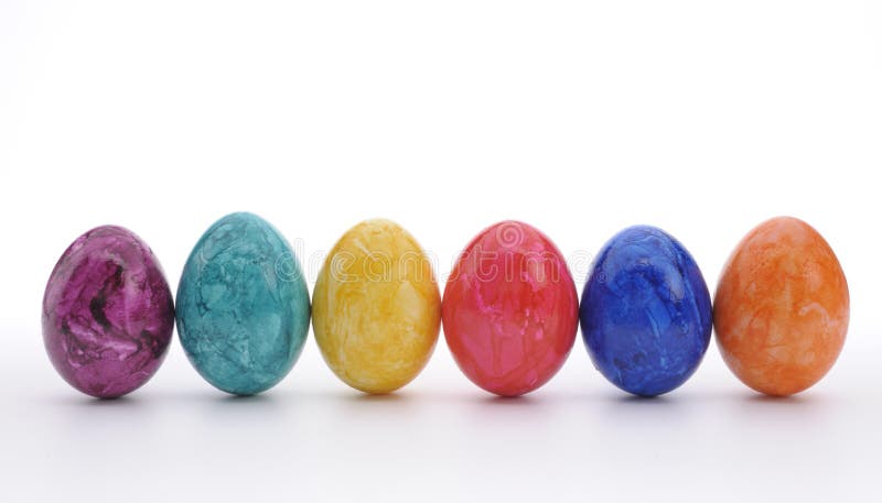 Six colorful easter eggs on white