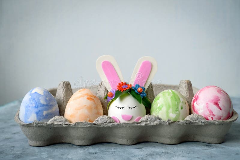 Easter egg card painted eggs and one egg decorated with bunny ears stock photo Easter egg card painted eggs and one egg decorated with bunny ears stock photo