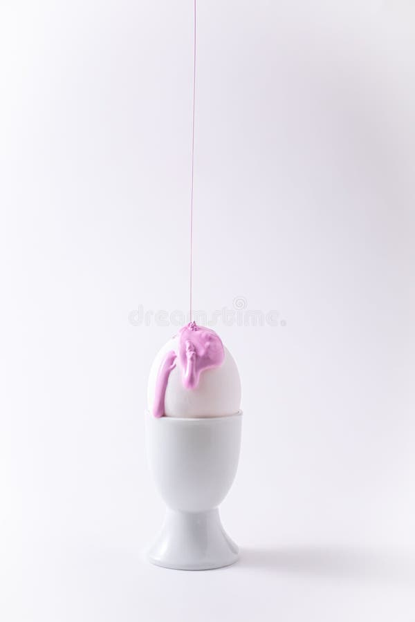 Easter Egg with Liquid Paint on it. Minimalism Concept. Pink Pastel