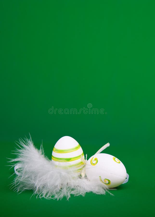 Easter egg in white feathers nest