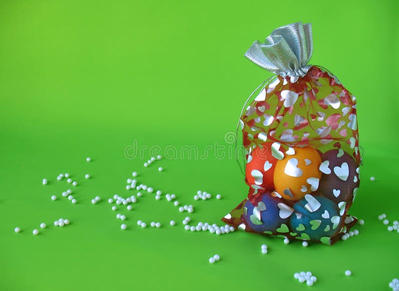 Easter eggs in bag with hearts and scattered beads