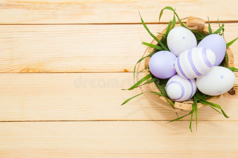 Easter eggs in a basket on rustic wooden background stock photography Easter eggs in a basket on rustic wooden background stock photography