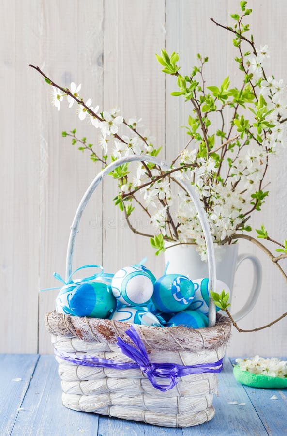 Easter eggs basket spring branches royalty free stock images