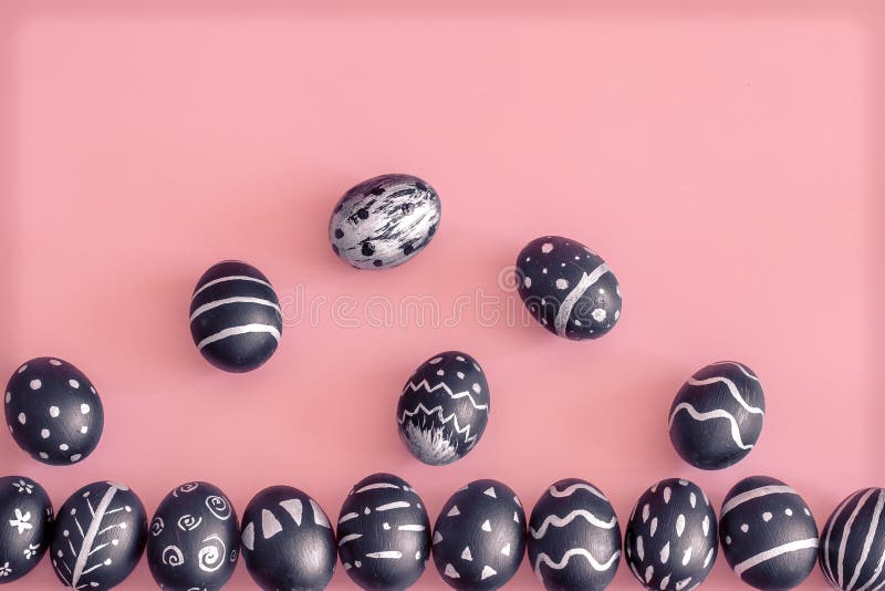 Easter eggs in black on a colored pink background