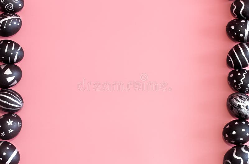 Easter eggs in black on a colored pink background