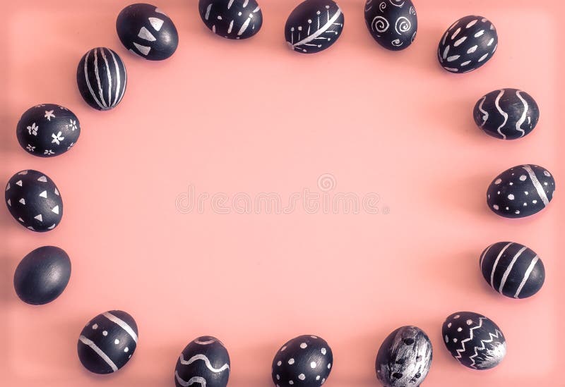 Easter eggs in black on a colored pink background